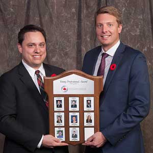 Michael Walker, P. Eng., PE, PMP accepting the Young Professional Award from ACEC-SK Chair Paul Walsh, P.Eng.